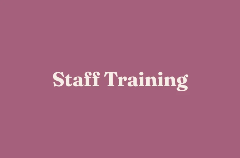 Cream serif lettering reading “Staff Training” is centred on a plain mauve background.